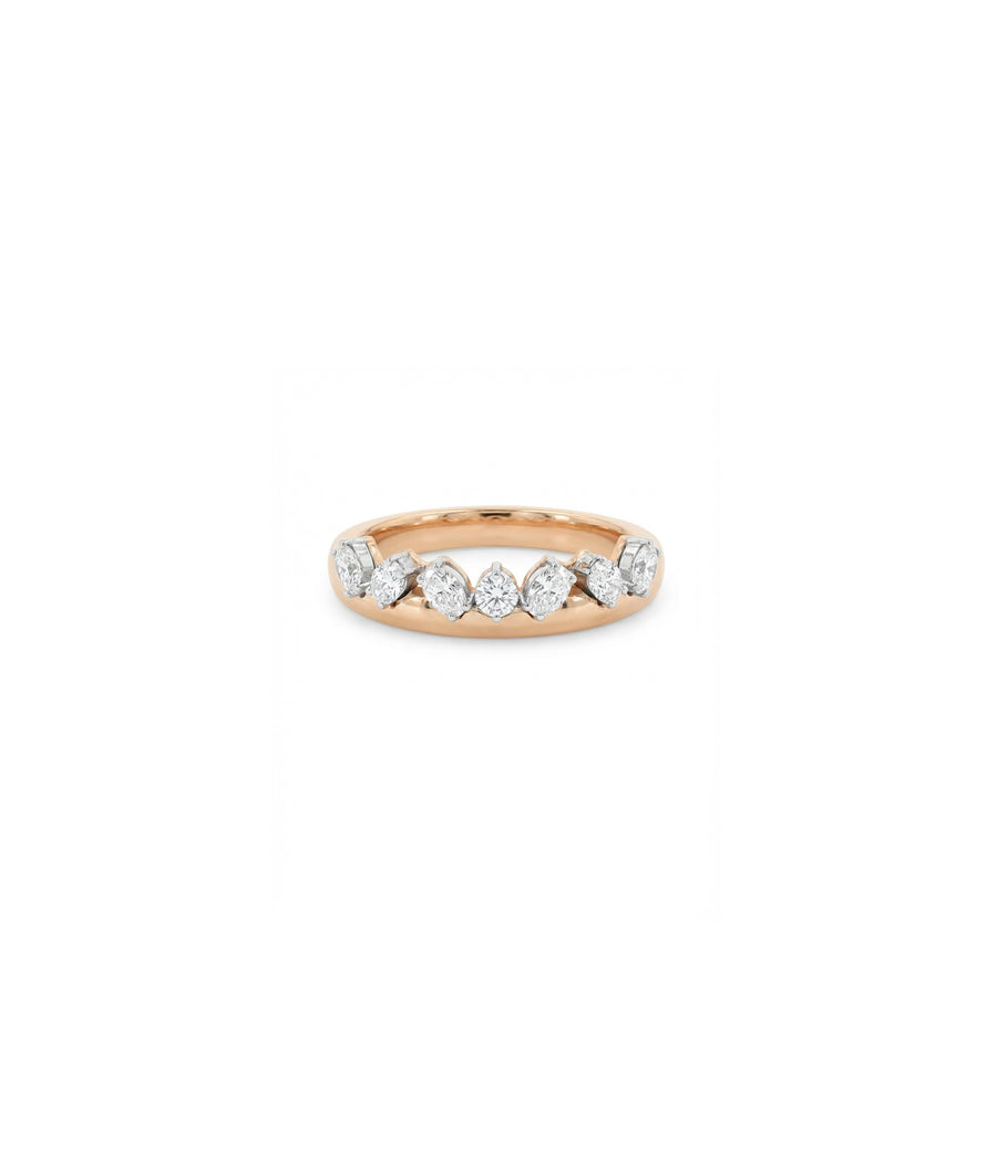 Rose gold band ring featuring seven round brilliant diamonds set in shared prong white gold settings