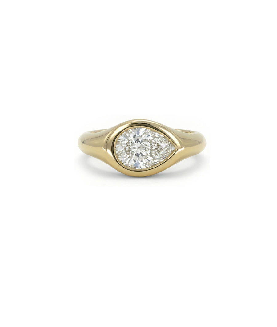 Bezel set diamond solitaire pinky ring in 14K yellow gold