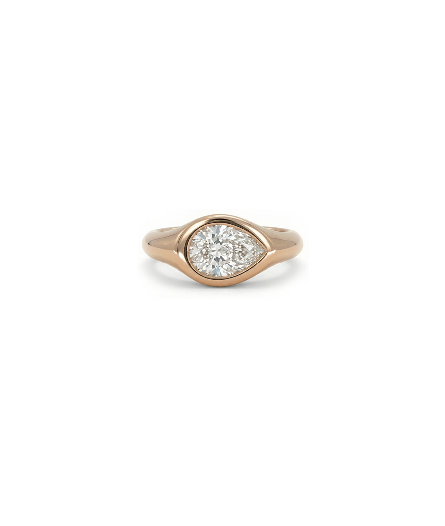 Bezel set pinky diamond solitaire ring in 14K rose gold