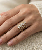 Model wearing diamond pavé heart solitaire ring in yellow gold
