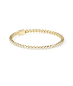 Bezel diamond tennis bracelet in 14K yellow gold side profile view