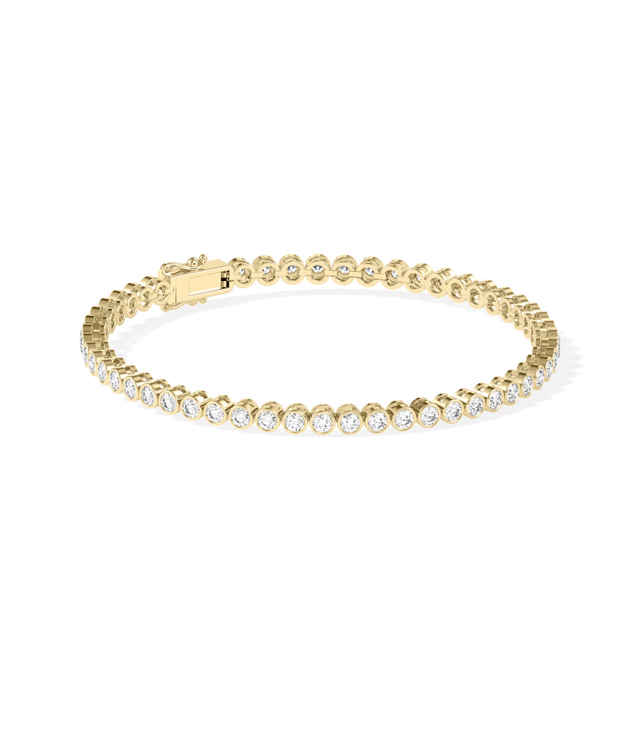 Bezel diamond tennis bracelet in 14K yellow gold side profile view