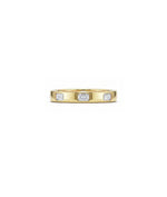 Bezel set emerald cut diamond band ring in 14K yellow gold