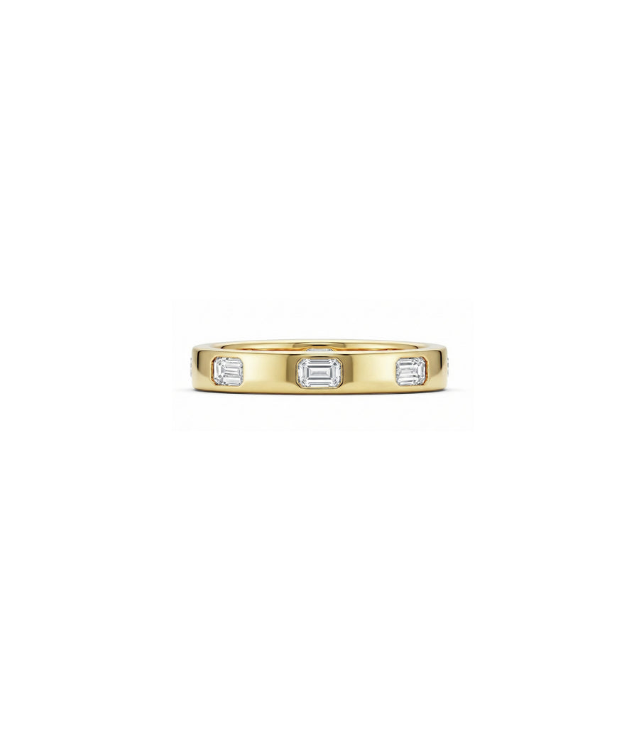 Bezel set emerald cut diamond band ring in 14K yellow gold