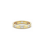 Bezel emerald cut diamond band ring in yellow gold side profile
