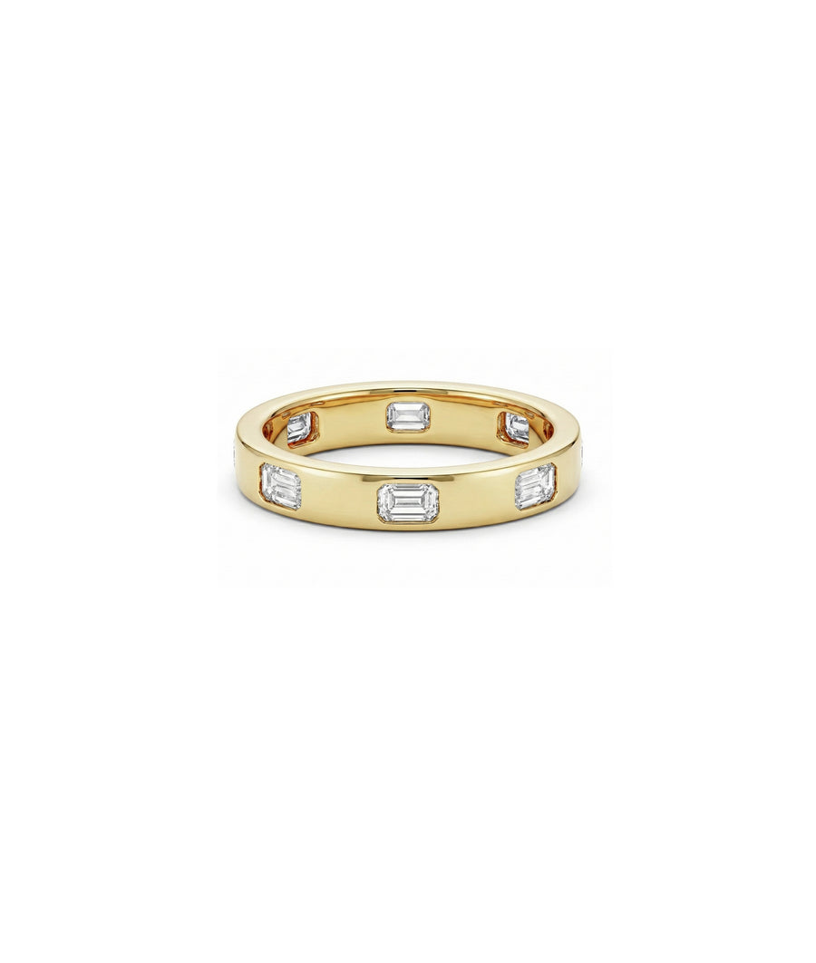 Bezel emerald cut diamond band ring in yellow gold side profile