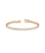 Bezel set emerald cut tennis bracelet in 14K rose gold