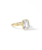 Bezel emerald lab diamond solitaire ring in 14K yellow gold side profile