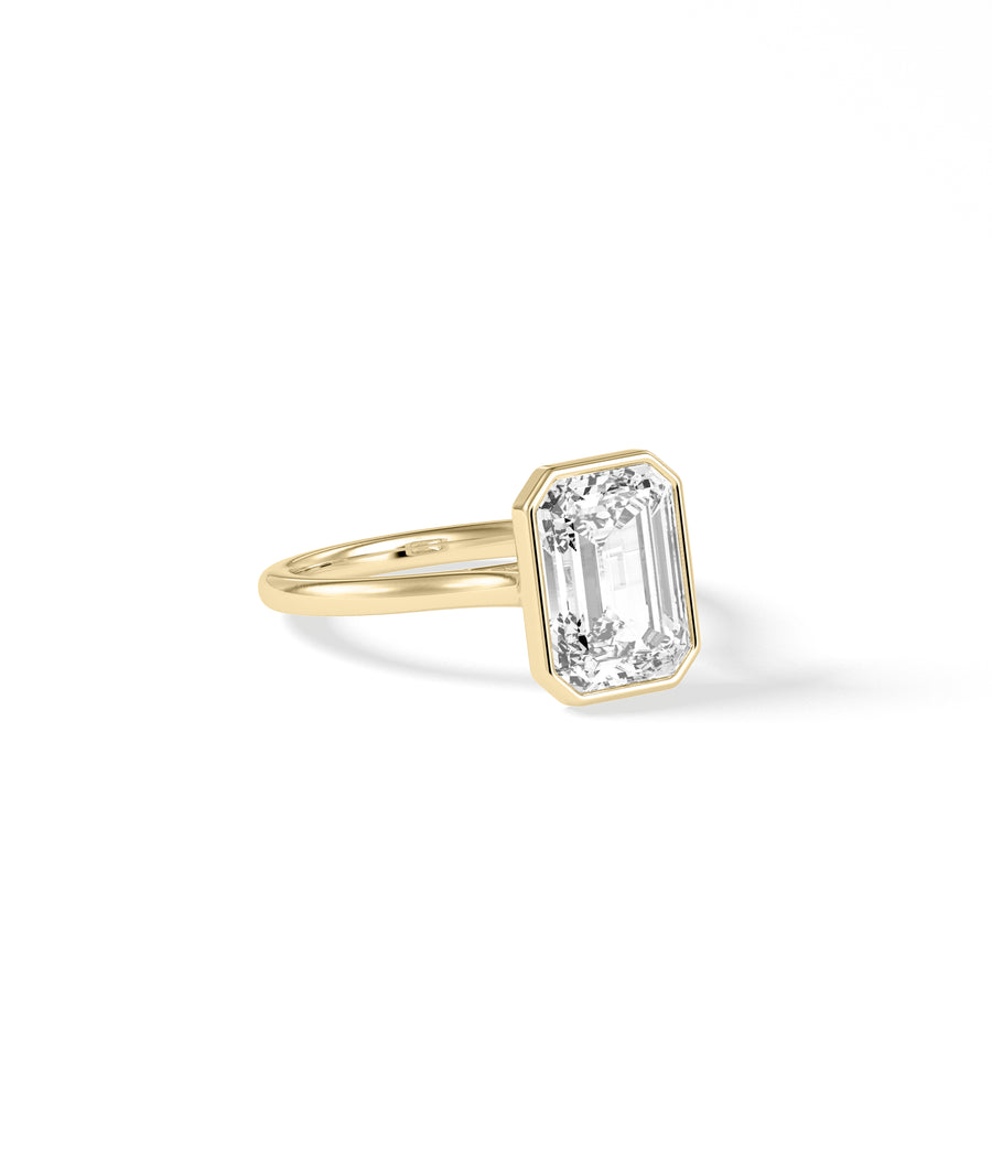 Bezel emerald lab diamond solitaire ring in 14K yellow gold side profile