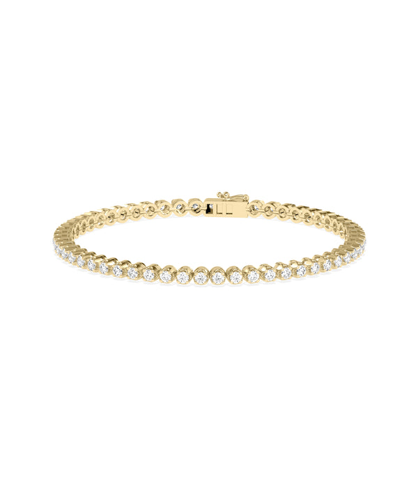 Bezel set diamond tennis bracelet in 14K yellow gold