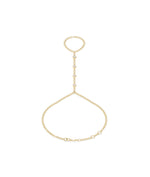 Dainty bezel set round lab diamond hand chain bracelet in yellow gold