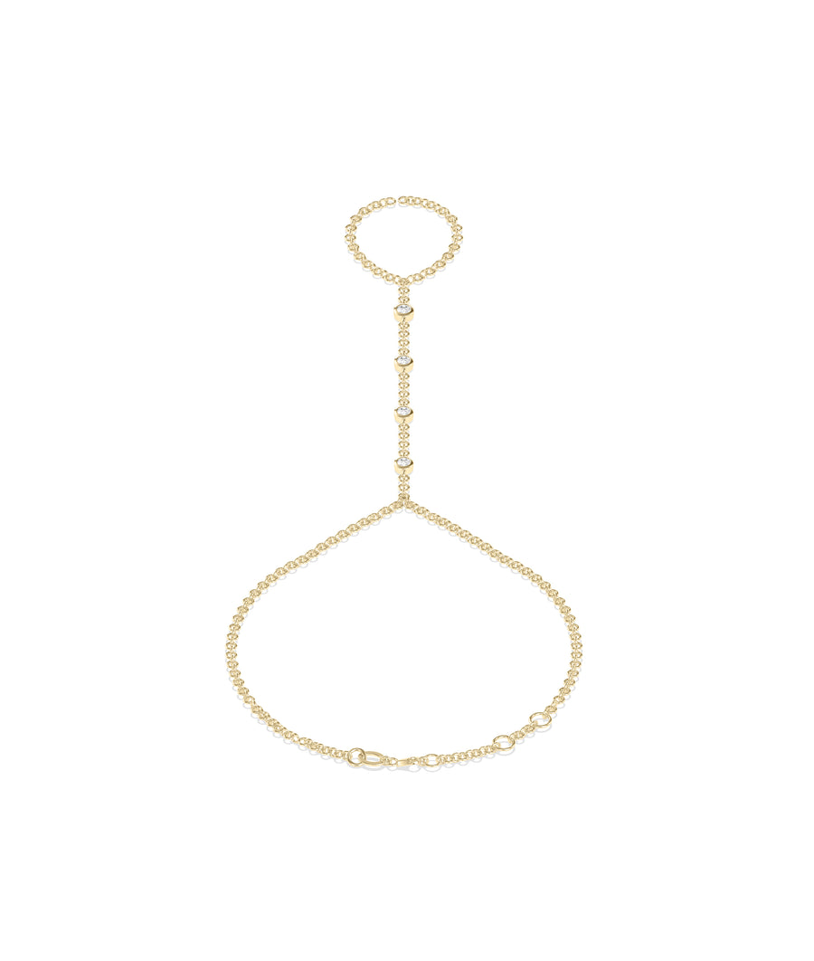 Dainty bezel set round lab diamond hand chain bracelet in yellow gold