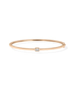 Bezel-set solitaire diamond bangle in 14K rose gold