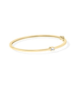 Bezel-set solitaire diamond bangle in 14K yellow gold side view