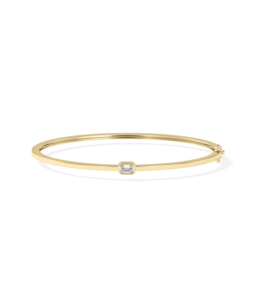 Bezel-set solitaire diamond bangle in 14K yellow gold