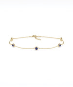 14K yellow gold bezel set blue sapphire station bracelet