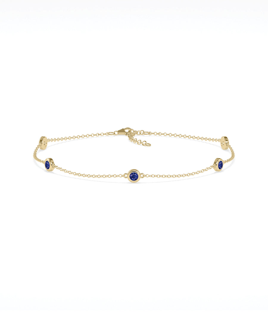 14K yellow gold bezel set blue sapphire station bracelet
