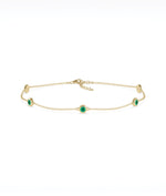 14K yellow gold bezel set emerald station bracelet