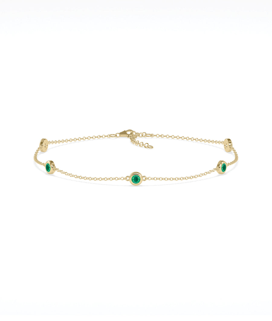 14K yellow gold bezel set emerald station bracelet