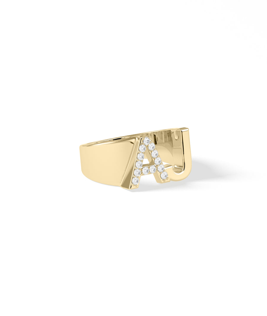 Bold diamond and gold initials ring side profile view in yellow gold