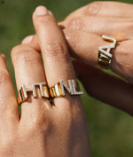 Model wearing bold gold initials ring in yellow gold personalized style