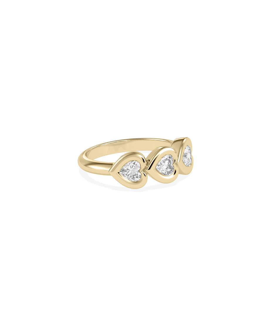 Side profile view of bubble bezel heart diamond band ring in 14K yellow gold