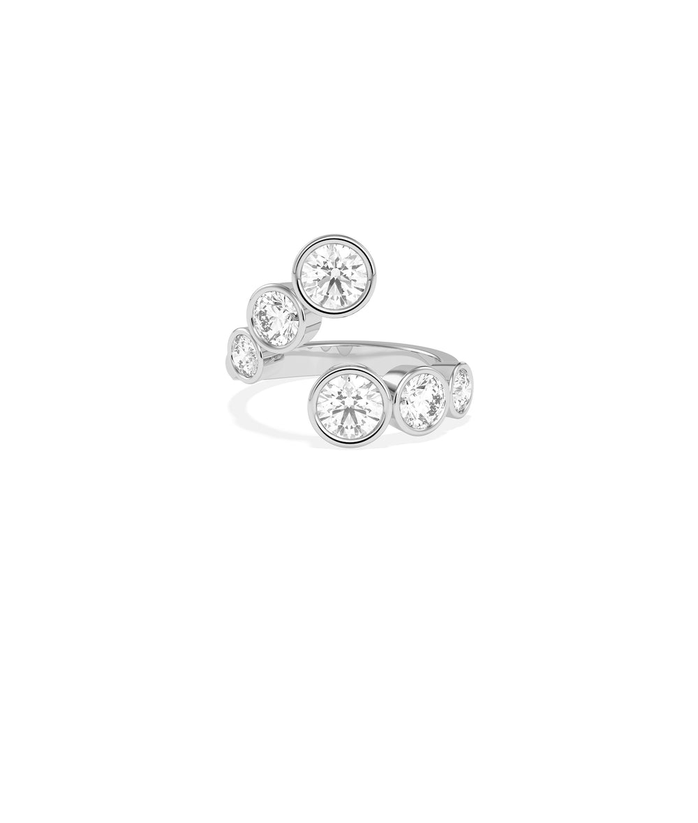 Bypass bezel-set round lab diamond ring in white gold with six graduating diamonds in an open wrap design