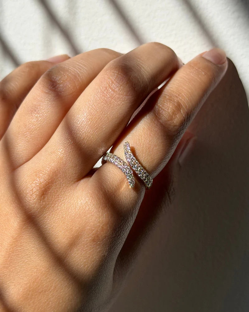 Model wearing bypass pavé diamond ring in 14K yellow gold