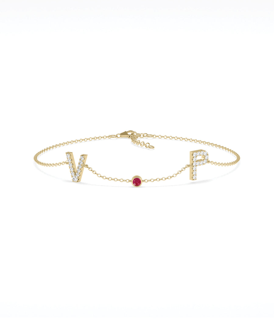 Custom initials solitaire bracelet in 14K yellow gold with ruby gemstone