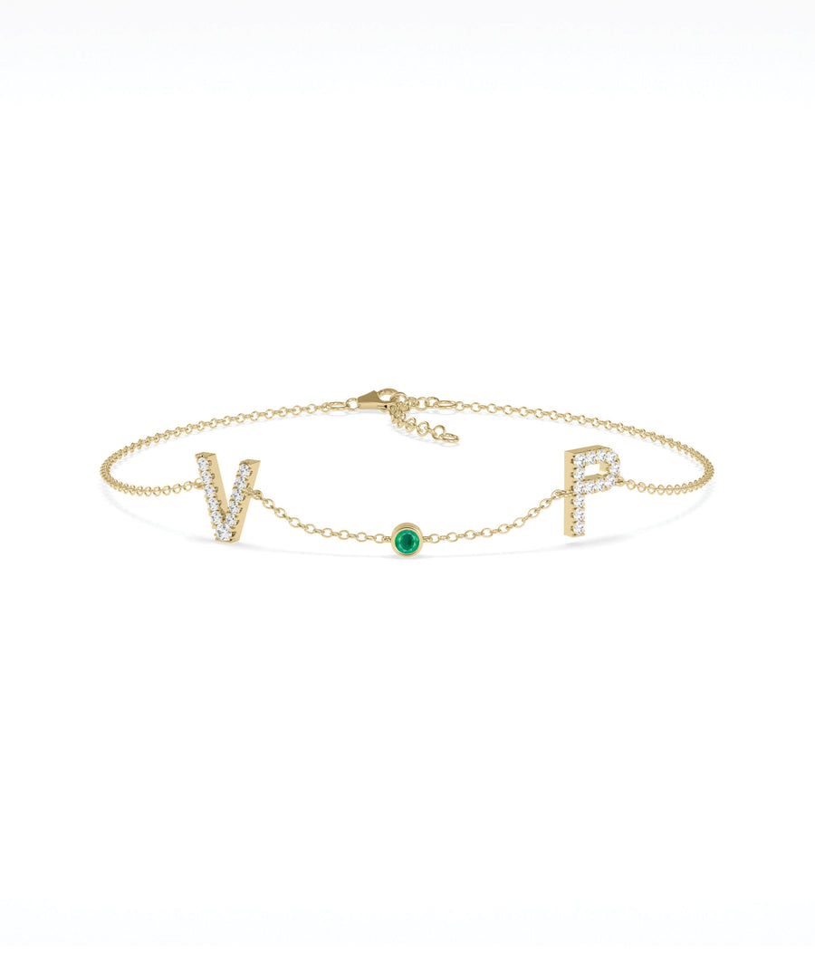 Custom initials solitaire bracelet in 14K yellow gold with emerald gemstone