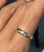 Model wearing diamond dome ring in 14K solid yellow gold band