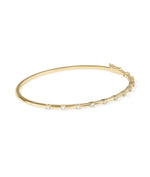 Diamond station bangle in 14K yellow gold, side view