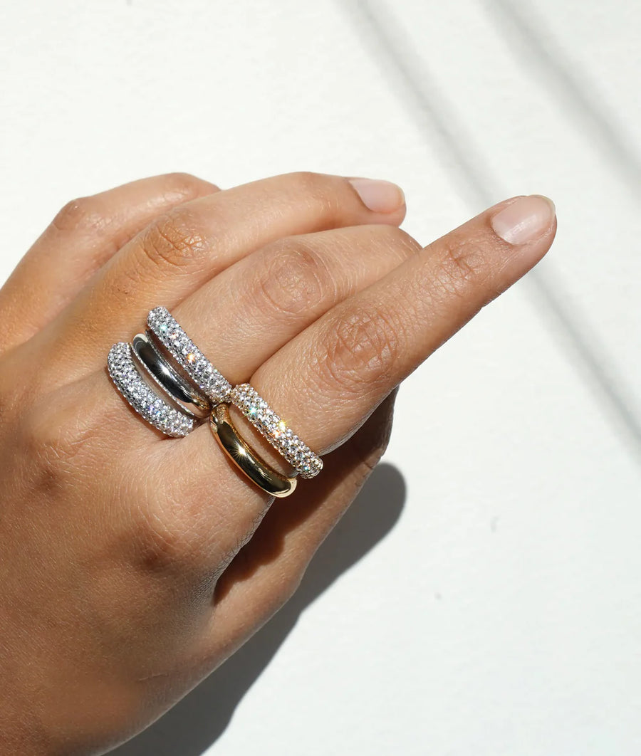 Model wearing double row diamond band ring in yellow gold