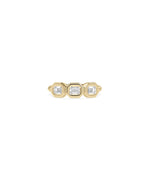 Emerald cut bezel set diamond band ring in yellow gold