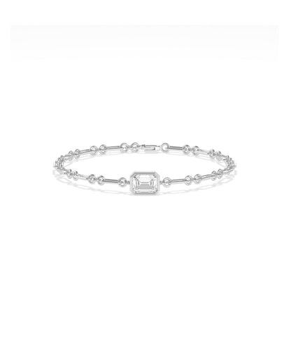 White gold chain bracelet featuring a bezel-set emerald-cut diamond centerpiece with bar and circle links