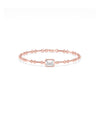 Rose gold chain bracelet featuring a bezel-set emerald-cut diamond solitaire centerpiece