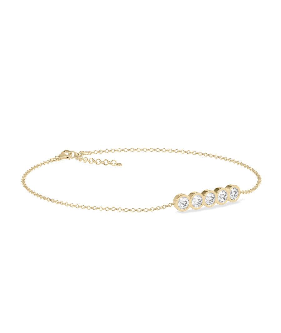 Five-stone bezel diamond bracelet in 14K yellow gold side profile view