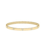 Fluted diamond bangle in 14K yellow gold bezel station setting
