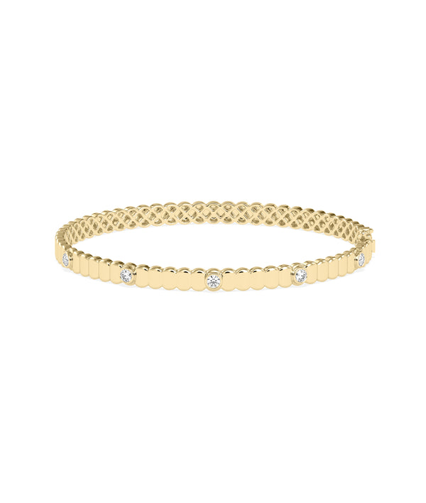 Fluted diamond bangle in 14K yellow gold bezel station setting