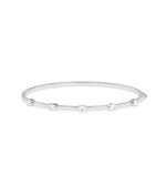Half bezel round lab diamond bangle in 14K white gold
