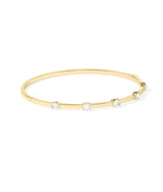 Half bezel round lab diamond bangle in yellow gold side profile view