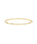 Half bezel round lab diamond bangle in 14K yellow solid gold