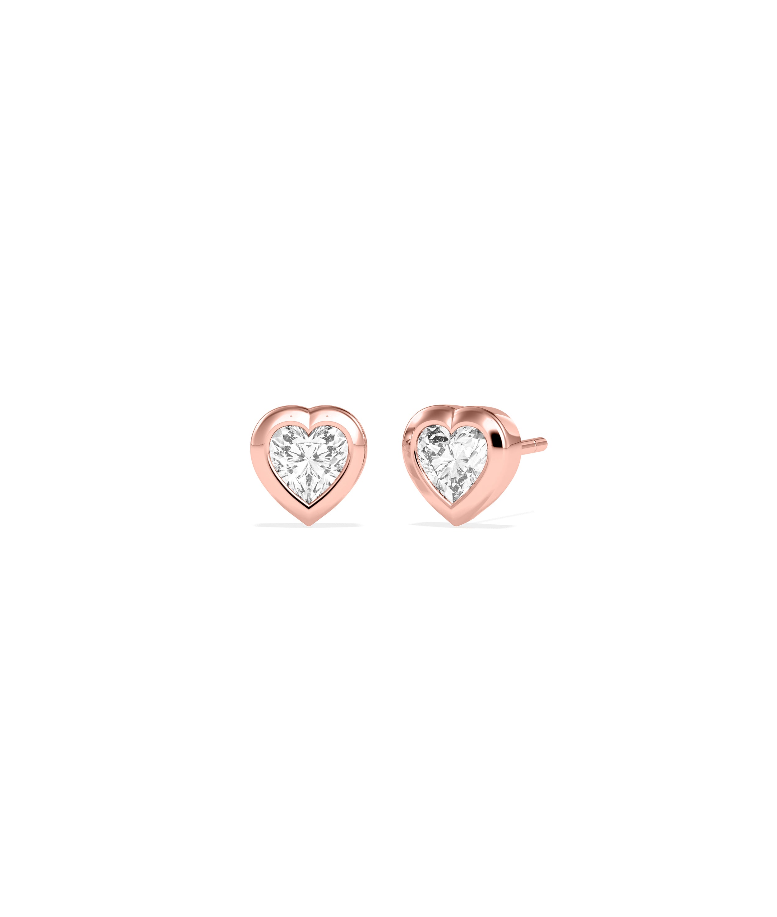 Heart-shaped diamond bezel stud earrings in rose gold, shown as a pair front and side view