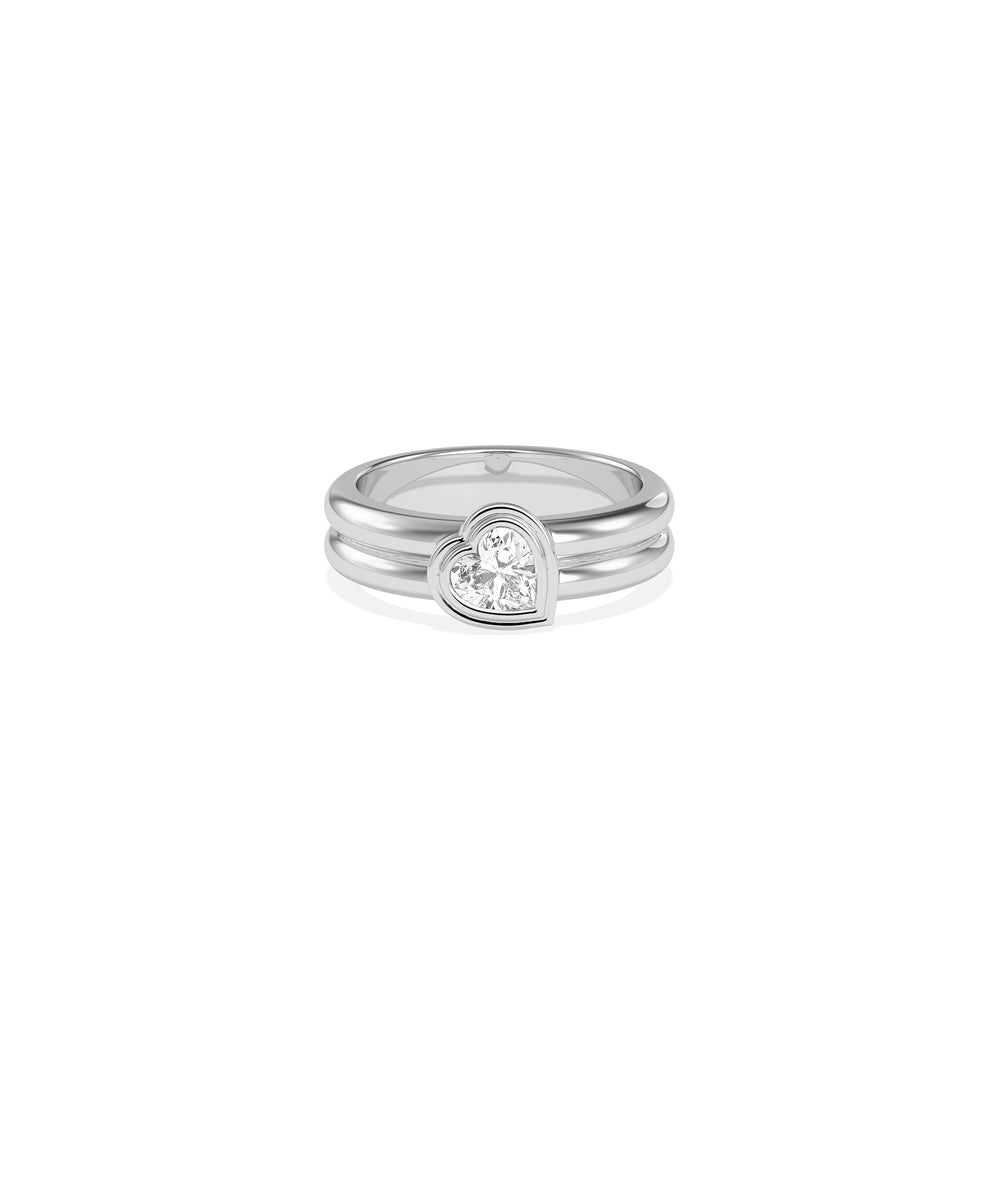 Heart-shaped diamond bezel-set solitaire ring in polished white gold with double band detail