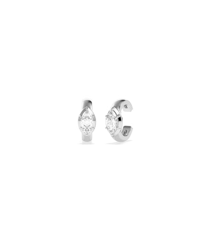 Pair of white gold ear cuffs each set with a marquise diamond in a tension-style setting