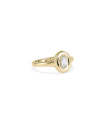 Oval bubble set solitaire diamond pinky ring in 14K yellow gold side profile