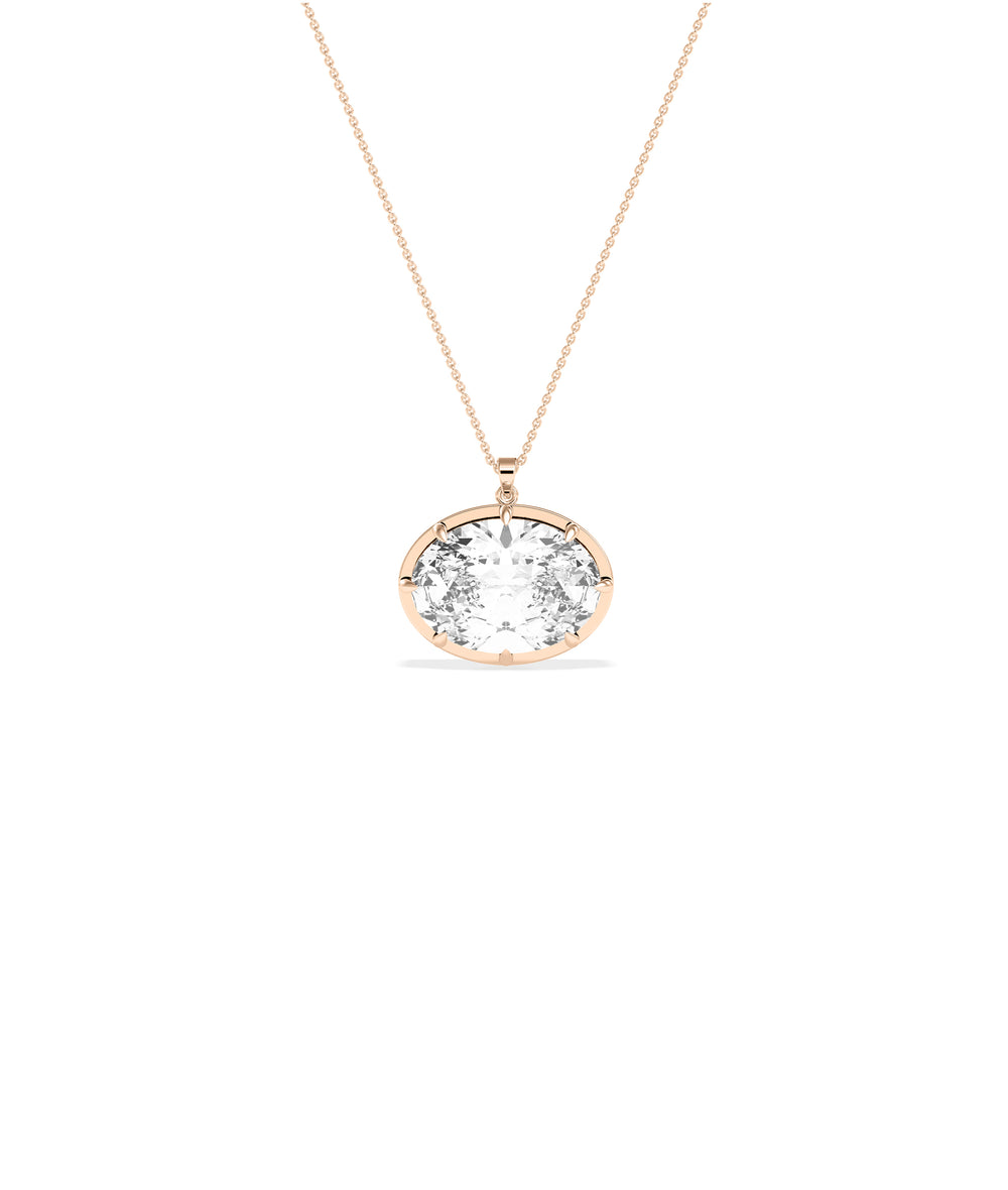 Large oval diamond pendant on a delicate rose gold chain with prong setting