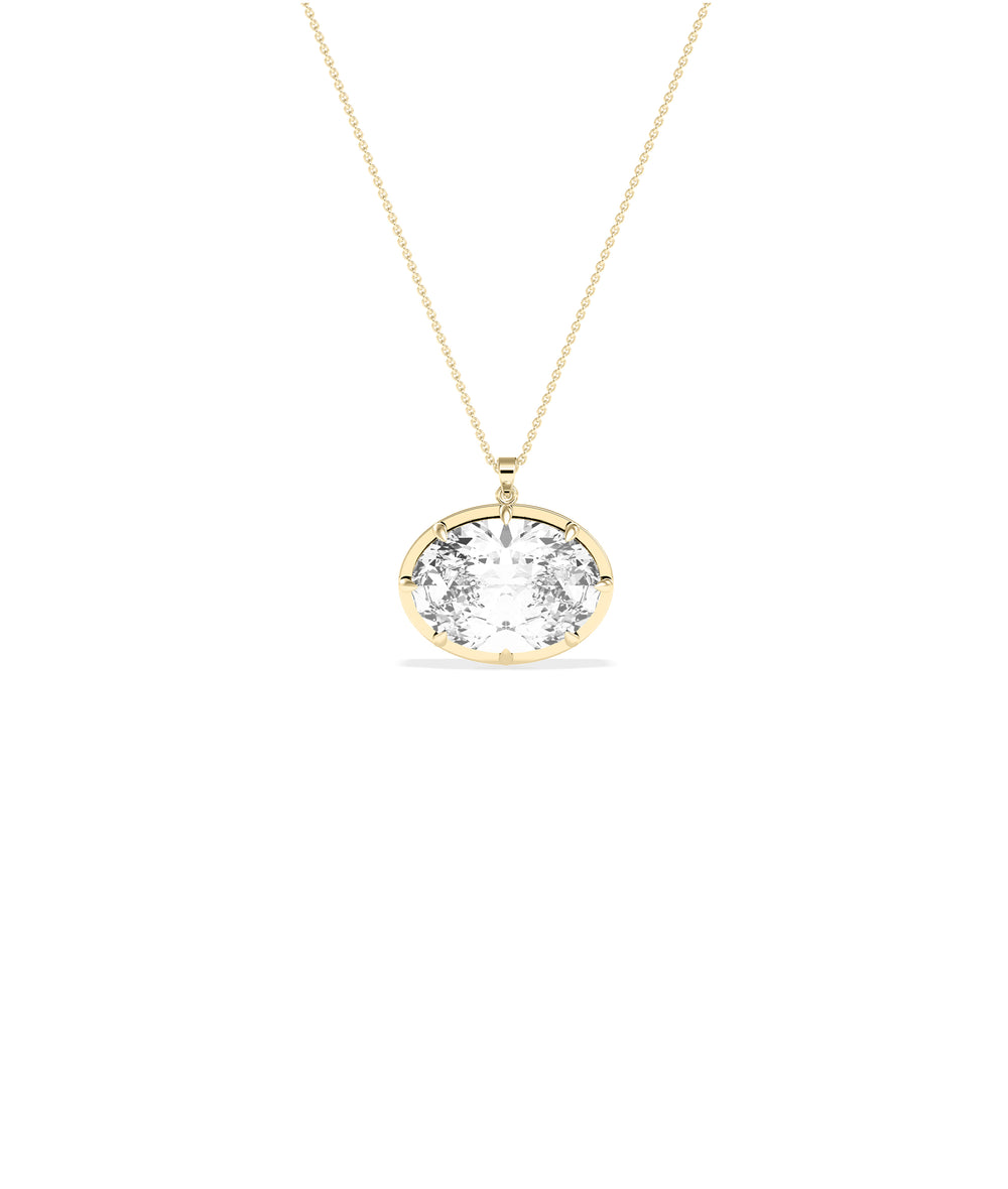 Large oval diamond pendant set in yellow gold prong bezel on delicate yellow gold chain
