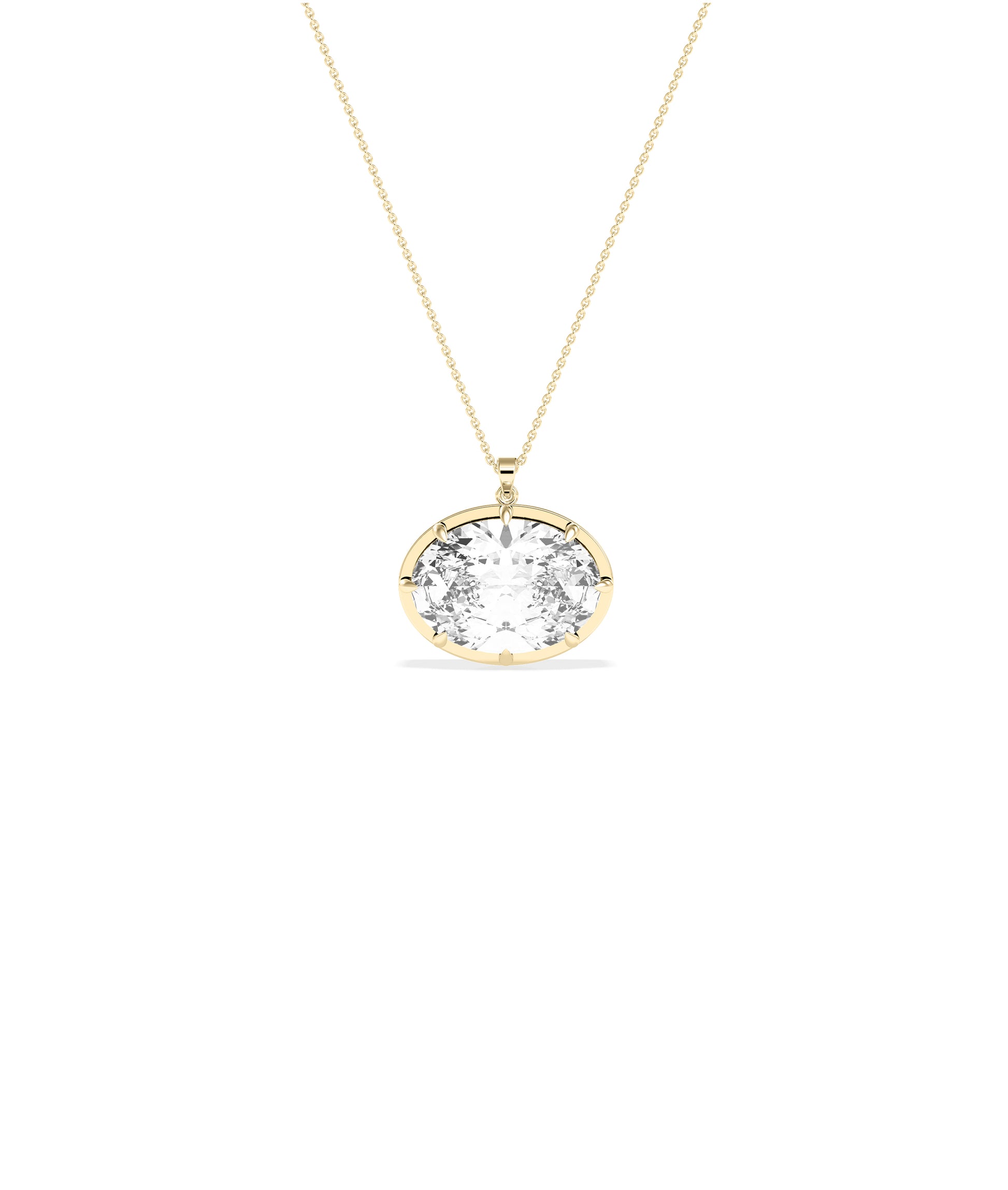 Large oval diamond pendant set in yellow gold prong bezel on delicate yellow gold chain