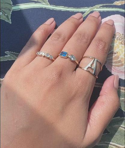 Large Gold Initial Ring on hand displaying confident statement sizing